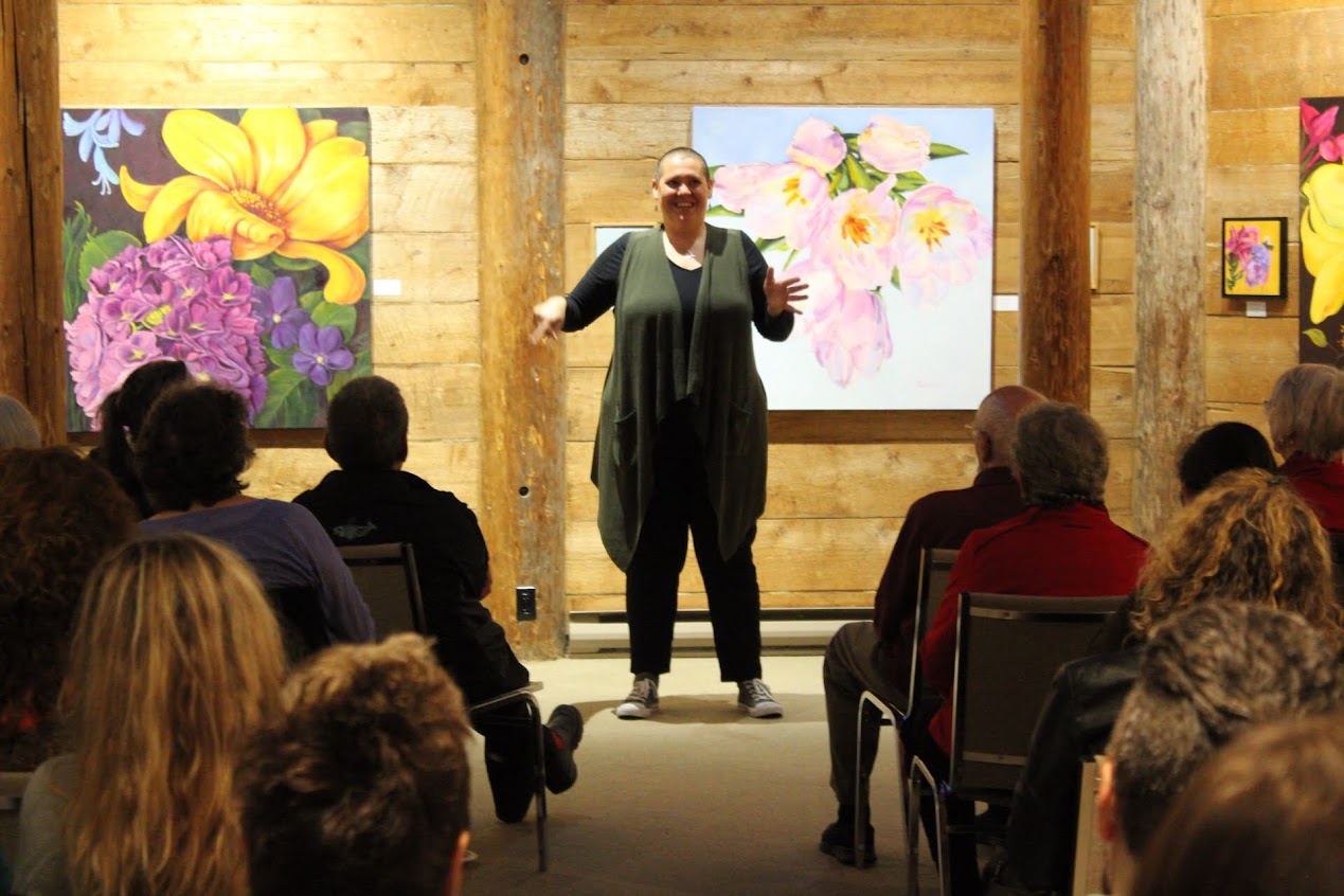 Krystin Clark speaking in front of an audience