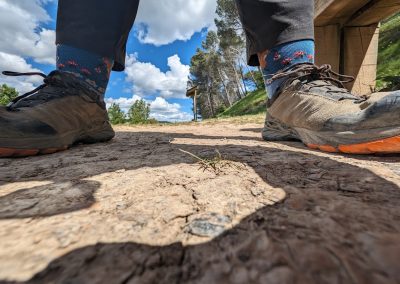 closeup view of Krystin's feet in well-worn walking shoes